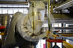 Rescuers in a radiation protection suit photo