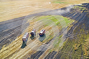 Rescuers rest in the field after extinguishing a strong fire