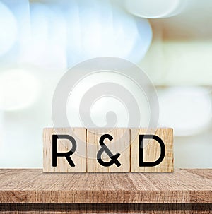Research and development, r&d word on wooden blocks over blur background, banner for business and technology concept