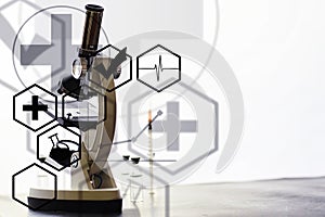 Research laboratory. Test tubes and microscope on the table. Double exposure.