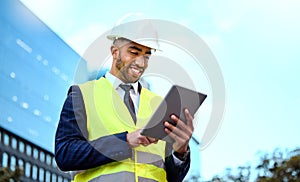 Research, tablet and a man construction worker in a city for planning, building or architectural design. Blue sky