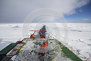 Research vessel cruising in ice and helipad