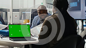 Researcher analyzes prototypes using laptop to optimize energy production photo