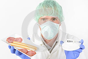 Researcher with food and preservatives