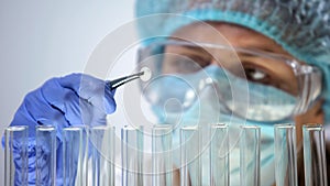 Researcher holding tablet, conducting medication quality control, effectiveness photo