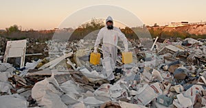 Researcher looking at plastic landfill analyzing environmental pollution