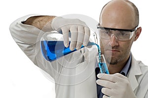 Researcher pouring chemicals into a test tube
