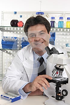 Researcher scientist sitting at laboratory desk