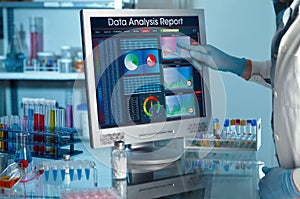 Researcher touching the screen of report research data