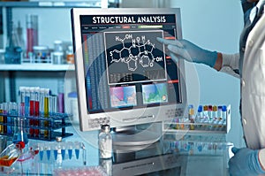 Researcher touching the screen of report of structural analysis
