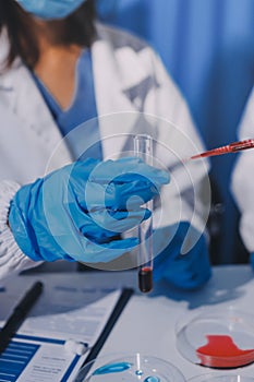 Researcher using a professional microscope
