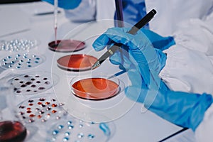 Researcher using a professional microscope