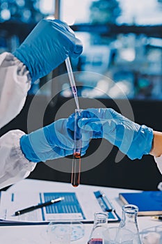 Researcher using a professional microscope