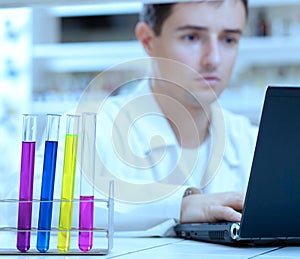 researcher working on a laptop