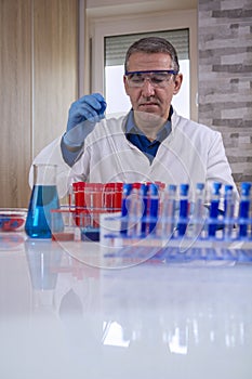 Researcher working with a Pipette in a Biochemistry Lab