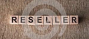 RESELLER word made with wooden building blocks. Business and sell concept