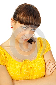 Resentful young girl in yellow dress photo