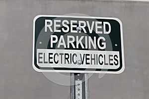Reserved Parking for Electric Vehicles sign. Many companies are reserving parking spaces close to entrances for electric vehicles