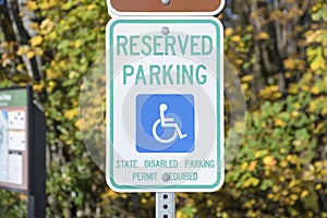 Reserved parking for a person with disability signage on a metal post at Tacoma in Washington