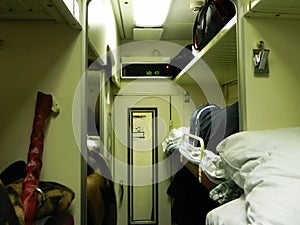 Reserved seat car on the train. Beds on the long-distance train. Used by passengers for sleeping and relaxing.