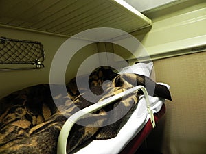 Reserved seat car on the train. Beds on the long-distance train. Used by passengers for sleeping and relaxing.