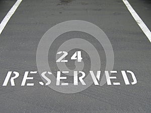 Reserved sign on the asphalt
