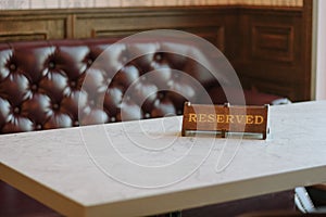 Reserved sign in a Cafe or restaraunt interior