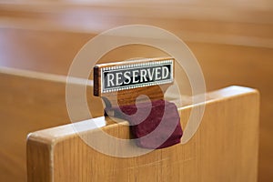 Reserved sign on church pew