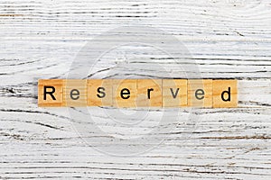 RESERVED word made with wooden blocks concept