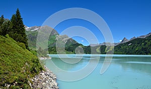 Reservoir lake with mountains epic landscape. Idyllic reservoir Kops lake at 1800 m in austrian Galtur, Vorarlberg