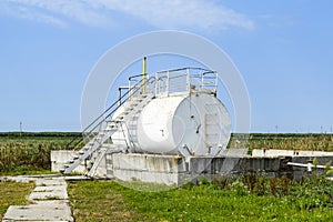 Reservoir for sludge of oil emulsion. Equipment at the oil field.