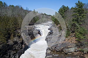 Reservoir Spillway Waterfall with rainbow.