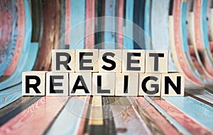 Reset, realign concept - abstract words written on wooden blocks photo