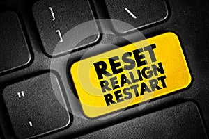 Reset Realign Restart text button on keyboard, concept background photo