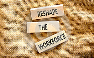 Reshape the workforce and support symbol. Concept words Reshape the workforce on wooden blocks on canvas. Beautiful canvas