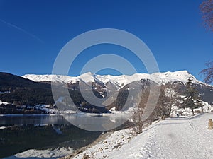 Resia Frozen Lake mountain country on the lake Alpi les alpes the alps italy i