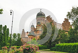 Residence of Metropolitan Bukovina against the backdrop of a summer garden. Tourist attraction of Chernivtsi