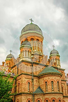 Residence of Metropolitan Bukovina against the backdrop of a summer green garden. Tourist attraction of Chernivtsi