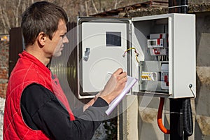 A resident of a country house takes readings of an electric energy meter