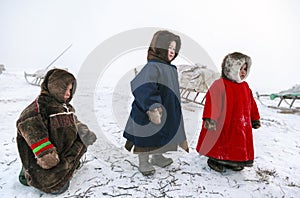 A resident of the tundra, indigenous residents of the Far North, tundra, open area, children ride on sledges, children  in