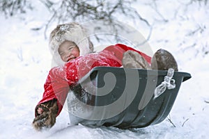 A resident of the tundra, indigenous residents of the Far North, tundra, open area, children ride on sledges, children  in