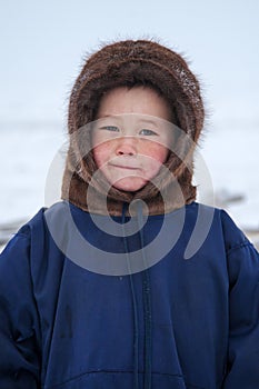 A resident of the tundra, indigenous residents of the Far North, tundra, open area, children ride on sledges, children  in