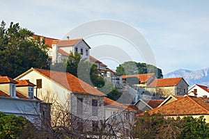 Residental buildings with red roofs. Montenegro, Prcanj town