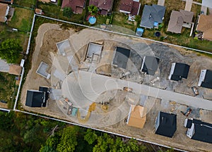 A residential aerial view of new housing development being built of a new home under construction