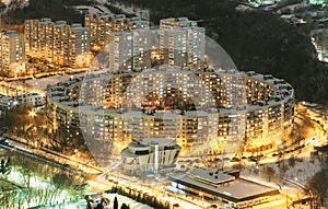 Residential apartment building in the form of a ring in Moscow at night