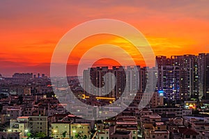 Residential area in chinese suburb in the evening with beautiful gold and red clouds