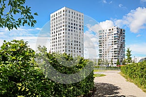 Residential area in the city, modern sustainable high-rise apartment buildings in a green environment