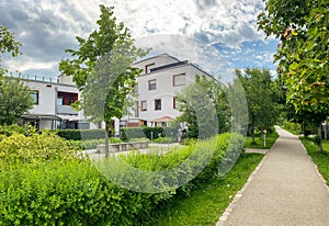 Residential area with ecological and sustainable green residential buildings, low-energy houses with apartments and green