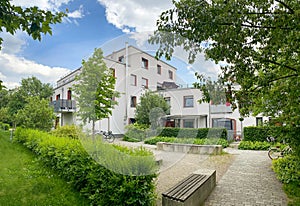 Residential area with ecological and sustainable green residential buildings, low-energy houses with apartments and green