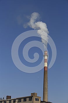 In residential areas, painted with red and white color of the chimney, risking white water vapor